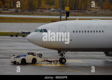 Jet aircraft docked plane at the airport on loading at airport during boarding operations Stock Photo