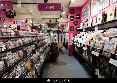 Customers browsing music - CDs and vinyl in HMV, a chain of music and computer game shops, Worcester, UK Stock Photo