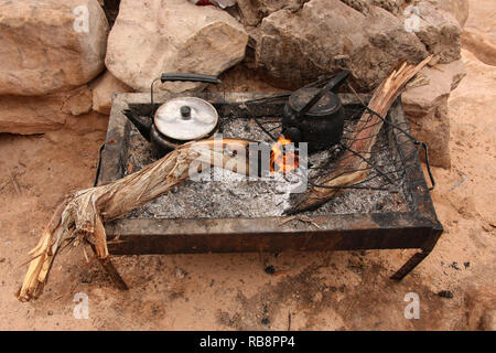 Traditional way of cooking Bedouin tea on an open fire Petra, Jordan Stock Photo