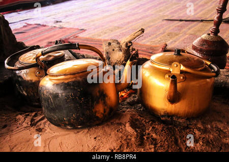 Traditional way of cooking Bedouin tea on an open fire in a desert Wadi Rum, Jordan Stock Photo