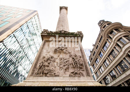 The Cibber relief at the base of the Monument to the Great Fire of London, more commonly known simply as the Monument, is a Doric column in London. Stock Photo