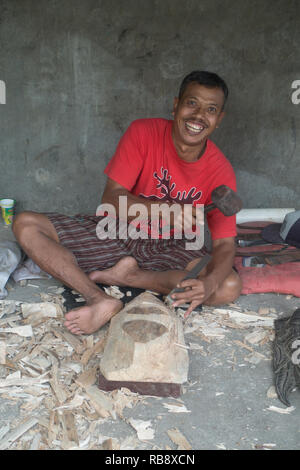 Woodworkers, craftsman in Bali making wooden statues. Stock Photo