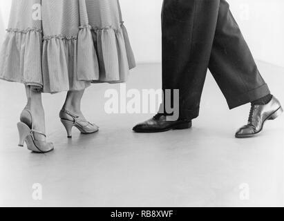 Learning to dance in the 1950s. A dancing teacher with his student is learning how to dance the Mambo dance. Sweden 1955 Stock Photo