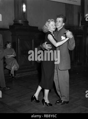 Dancing in the 1950s. A young couple is dancing and moving to the music. Sweden Ref 34K-34 Stock Photo