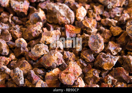 Red color of Iron oxide on gravel surface of broken laterite stone Stock Photo