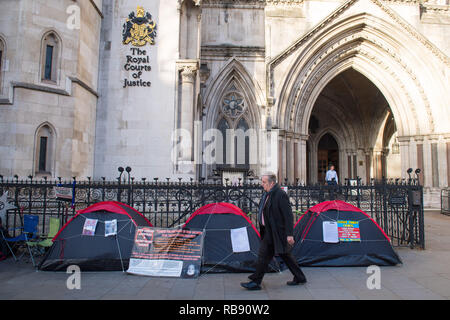 General view of tents outside the Royal Courts of Justice, where demonstrators are camping outside London's biggest courts complex as part of a protest against 'secrecy' in family courts. Stock Photo