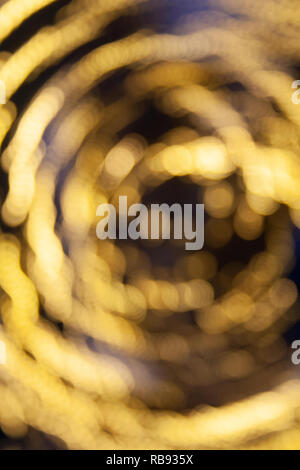 Abstract background yellow bokeh lights, vortex, dream, magic Stock Photo