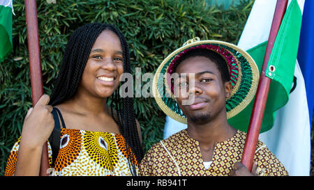 A nice portrait of two students in traditional clothes posing for the camera Stock Photo