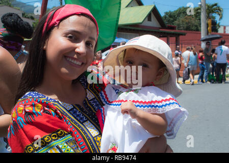 A mother and her son in traditional Costa Rican clothes are posing for the camera Stock Photo