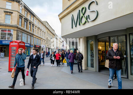 High street shoppers are pictured walking past a Marks & Spencer department store shop in Bath,England, UK Stock Photo