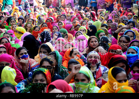 Dhaka, Bangladesh. 8th January, 2019. Bangladeshi garments worker block a road during a protest in Dhaka, Bangladesh, on 08, 2019. Hundreds of Garment workers have been protesting since 6 December to demand the government implement the new wage structure it has declared for the sector, including the minimum wage. Credit: Mamunur Rashid/Alamy Live News Stock Photo