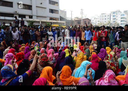 Dhaka, Bangladesh. 8th January, 2019. Bangladeshi garments worker block a road during a protest in Dhaka, Bangladesh, on 08, 2019. Hundreds of Garment workers have been protesting since 6 December to demand the government implement the new wage structure it has declared for the sector, including the minimum wage. Credit: Mamunur Rashid/Alamy Live News Stock Photo