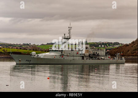 Bantry, West Cork, Ireland. 8th Jan, 2019. On the 40th Anniversary of the Whiddy Island disaster, in which the French oil tanker Betelgeuse exploded killing 50, a huge crowd attended the formalities in Abbey Graveyard, Bantry. Irish Naval Patrol Vessel LÉ James Joyce lies in Bantry Bay as a tribute to the dead.  Credit: AG News/Alamy Live News. Stock Photo