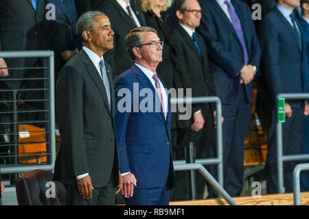 Former U.S. President Barack Obama and Former Secretary of Defense Ash Carter stand at attention during an Armed Forces Full Honor Presidential Farewell Review, Jan. 4, 2016 at Conmy Hall, Joint Base Myer-Henderson Hall, Va. Stock Photo