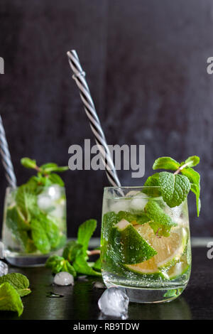 Mojito Cubano or caipirinha cocktail, iced drink with lime and mint Stock Photo