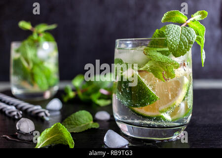 Mojito Cubano or caipirinha cocktail, iced drink with lime and mint Stock Photo
