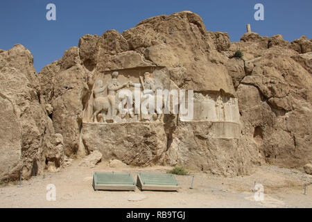 Bas-relief of the coronation of Ardashir I, famous carving from necropolis Naqsh-e Rustam in the north of the administrative center of Shiraz, Iran. Stock Photo