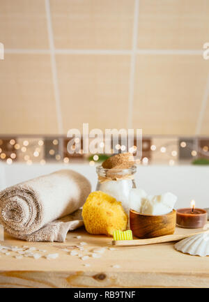 Using natural material products in home, different eco friendly cosmetic products in bathroom. Minimizing ecological footprint concept. Bamboo bath to Stock Photo
