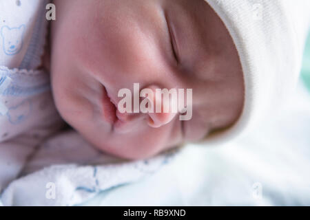 Sleeping few day-old baby newborn. Mellow sleepy newborn phase concept Stock Photo