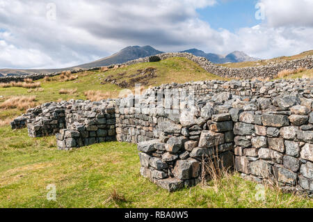 Scenic view of the Hardknott Roman Fort in the English Lake District with the Scafell Mountain Range in the background. Stock Photo