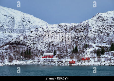 Red rorbu houses in Norway in winter Stock Photo