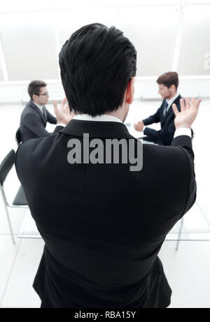 rear view.businessman holds a working meeting. Stock Photo