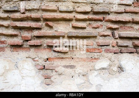 Old decayed stone brick wall background Stock Photo