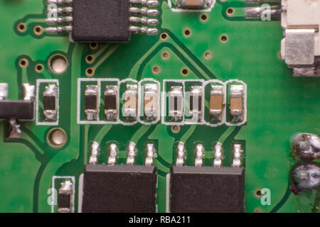 Closeup electronic hardware .Resistor and condensers assembly on the circuit board Stock Photo