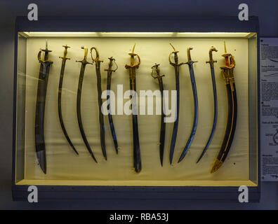 Jodhpur, India - Nov 7, 2017. Ancient swords at Mehrangarh Fort Museum in Jodhpur, India. Built in around 1460, the fort is situated 125m above the ci Stock Photo