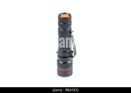 black metal pocket flashlight with a button on the handle isolated on white background Stock Photo