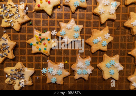 Decorated christmas cookies on a baking sheet Stock Photo