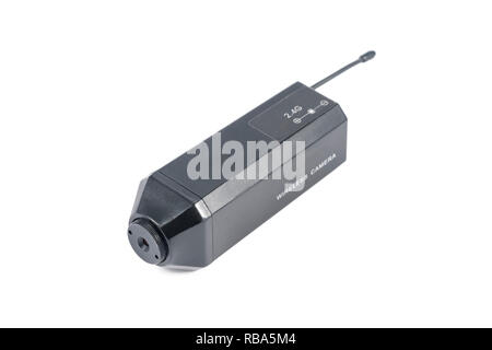 Small wireless spy camera in metal case with antenna isolated on white background Stock Photo