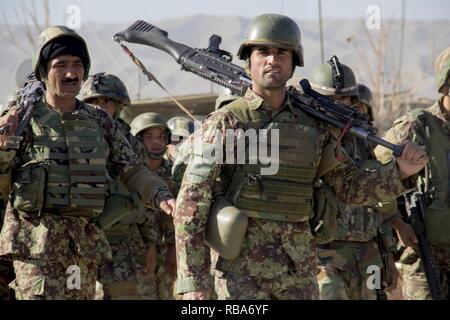 Soldiers assigned to the 201st  Afghan National Army Corps return from conducting collective training near Camp Torah in Sarobi district, Afghanistan, Dec. 27, 2016.  The training was conducted as part of the corps winter campaign strategy designed to build capability and capacity within the organization. Stock Photo