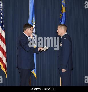 Brig. Gen. Russ Walz, Director of Doint Staff, South Dakota National Guard, administers the officer's oath to Col. Quenten M. Esser, 114th Operations Group commander, during Esser's promotion ceremony Jan. 8, 2017 Joe Foss Field, S.D. Esser assumed command of the 114th Operations Group from Col. Gregory Lair on May 1, 2016. Stock Photo