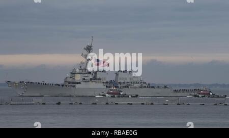 NORFOLK, Va. (Dec. 16, 2018) The Arleigh Burke-class guided-missile destroyer USS Arleigh Burke (DDG 51) prepares to pull into port after conducting a scheduled deployment. Arleigh Burke returns to Naval Station Norfolk following the Harry S. Truman Carrier Strike Group's (HSTCSG) deployment in support of maritime security operations and theater security cooperation efforts in the U.S. 2nd, 5th and 6th fleet areas of responsibility. Stock Photo