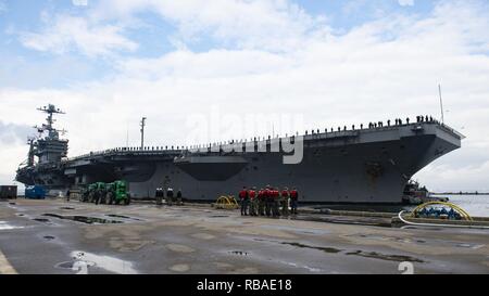 NORFOLK, Va. (Dec. 16, 2018) The Nimitz-class aircraft carrier USS Harry S. Truman (CVN 75) returns to homeport after conducting a scheduled deployment. Truman returns to Naval Station Norfolk following the Harry S. Truman Carrier Strike Group’s (HSTCSG) deployment in support of maritime security operations and theater security cooperation efforts in the U.S. 2nd, 5th and 6th Fleet areas of responsibility. Stock Photo