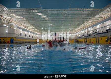 Recruits receive training at the USS Indianapolis Combat Pool at ...