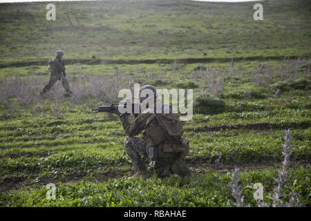 Spanish Armed Forces soldiers maneuver off the range upon completion of ...