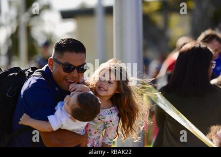Members of the USCGC Kimball crew greet family following their arrival to homeport in Honolulu for the first time Dec. 22, 2018. The crew transited from Pascagoula, Mississippi to Hawaii. Stock Photo