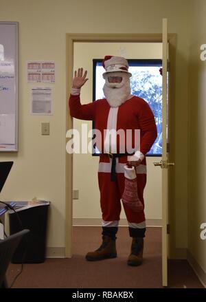 During his dry run prior to his BIG night, Santa Claus stops in southwest Georgia to spread some holiday cheer and visit the Army Corps of Engineers’ debris management team that’s working to clean up the debris Hurricane Michael left behind Dec. 23, 2018. Throughout the day, he made stops throughout the area, spreading holiday cheer both in the office and with teammates in the field. He even gave some on the spot safety training at one of the debris management sites. More than 125 employees from across the Corps are spending the holidays in southwest Georgia working to clear an estimated five  Stock Photo