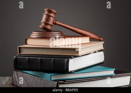 Pile of books and gavel Stock Photo