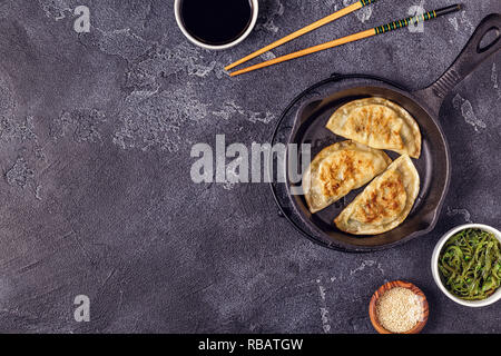 Gyoza or dumplings snack with soy sauce, top view. Stock Photo