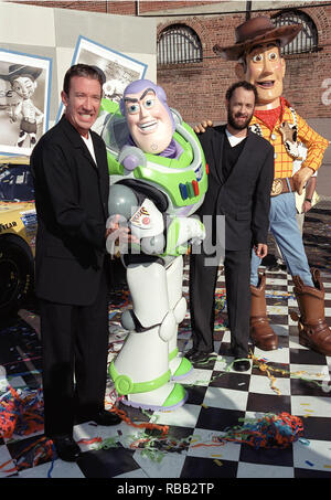 23OCT99: Actors TIM ALLEN (left) & TOM HANKS with 'Toy Story' characters 'Buzz Lightyear' & 'Woody' whose voices they portray in the films. They were at a promotion in Hollywood to unveil three NASCAR racing cars themed to 'Toy Story 2' which opens next month.        © RTSmith / MediaPunch Stock Photo