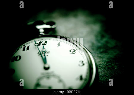 pocket clock indicating two minutes to midnight, concept for doomsday clock Stock Photo