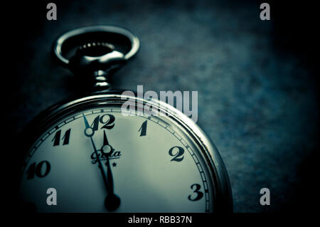 pocket clock indicating two minutes to midnight, concept for doomsday clock Stock Photo