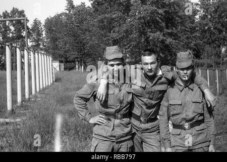 MOSCOW REGION, RUSSIA - CIRCA 1992: Soldiers of the Russian army on the sports field. Film scan. Large grain. Stock Photo