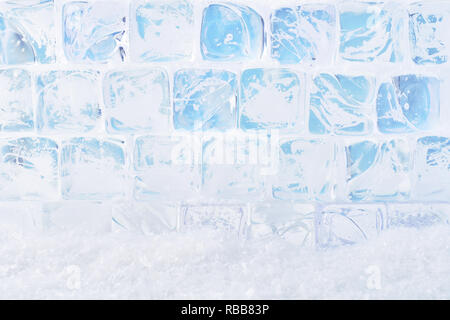 Ice cubes with snow background. Copy space for text or design element. Stock Photo