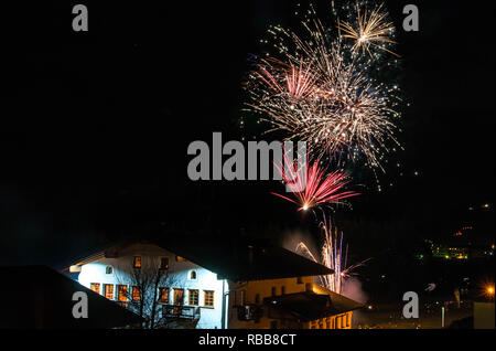 Colourful Fireworks in black sky on mountain baita Stock Photo