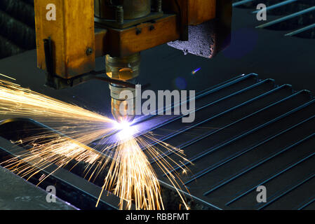 laser cutting torch machine in an industrial plant cuts sheet metal Stock Photo