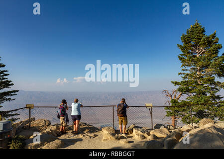 Visitors looking down at the stunning view of Palm Springs from the Palm Springs Aerial Tramway viewpoint, California, United States. Stock Photo
